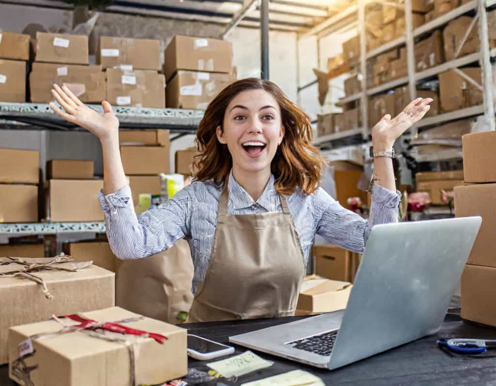 lifting her arms up to the sky in shear frustration  and disbelief that the ecommerce cms she has chosen doesn't give he the flexibility and hinders her opportunity to grow her online store.